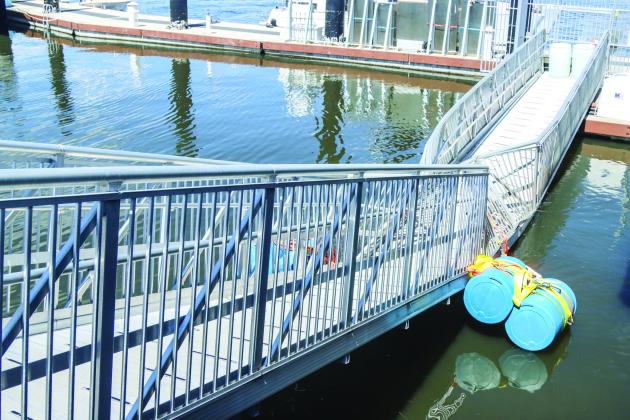 The gangway is blocked off Sunday and floats had been added to keep it from falling completely into the water. Ashley Chandler/News-Leader