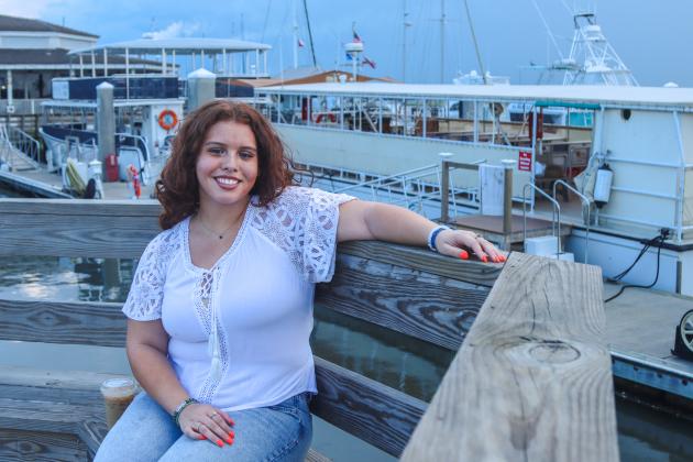 Quinn Ortiz at the Downtown Harbor Marina on Aug. 17. Quinn holds the title of 'Miss Nassau' after placing in the Top 25 at Florida's state competition with National American Miss. She is heading for nationals, set for the week of Thanksgiving. The Yulee native said she spends a lot of time in downtown Fernandina Beach with her friends. Photo by Ashley Chandler/News-Leader