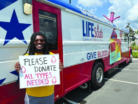 Photos by Nick Blank/News-Leader  LifeSouth blood donor recruiter Deuandre Elam advocates for blood donation outside HCA Florida Yulee Emergency Monday.
