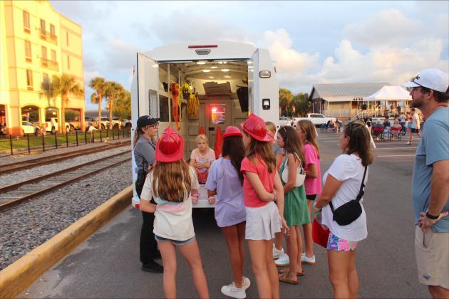 Calyx Eklund showing children the crime scene investigation van. Photo by Marisa DeMar/News-Leader