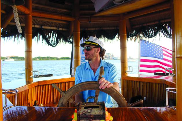 Owner and captain Ryan Ian Spinella during the sunset cruise last Monday Aug. 11. By Marisa DeMar/News-Leader