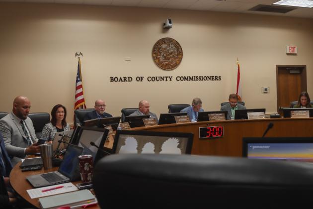 The Board of County Commissioners prepares for its Aug. 11 meeting. Photo by Ashley Chandler/News-Leader