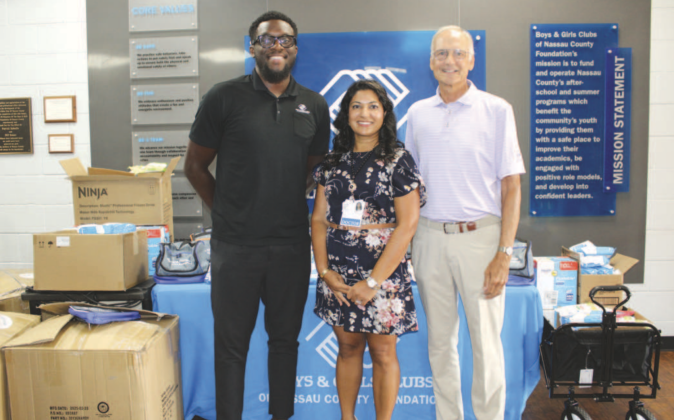 Shilpa Amin M.D., Bill Austen, and Landward Griffin in front of the donation table. Photo by Marisa DeMar/News-Leader