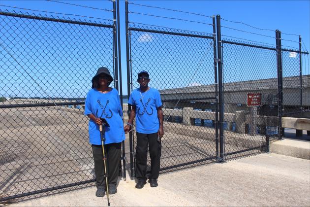 James and Leatrice Bell stand in front of the blocked off bridge.