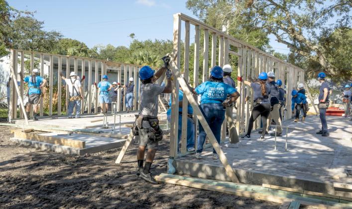 Omni Amelia Island employees work on a Habitat for Humanity home on South 10th Street. This is the third consecutive year the hotel has sponsored a home. Nick Blank/News-Leader