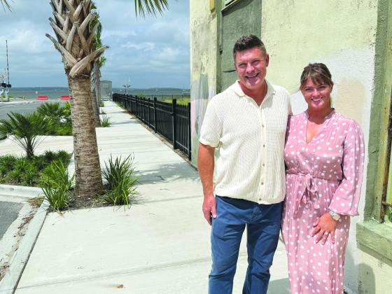 James and Jenny Shaffer stand in front of the historic Standard Marine building, which they plan to renovate.