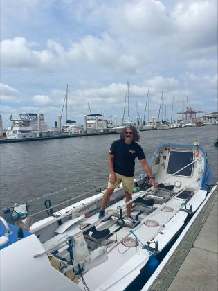 Paul Lore on the row boat in the Fernandina Beach Harbor on Sept 9.  By Marisa DeMar/News-Leader 