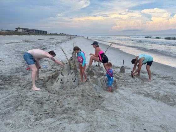 Sheehan’s children and grandchildren building their annual castle in August.