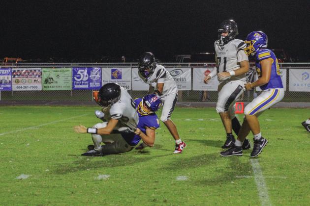 Fernandina Beach defensive end Kalani Tucker sacks Duval Charter School’s quarterback late in the second quarter.