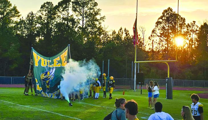 Jim Luksic / Members of the Yulee varsity football team prepare to take the field before their game Friday against visiting Charlton County.