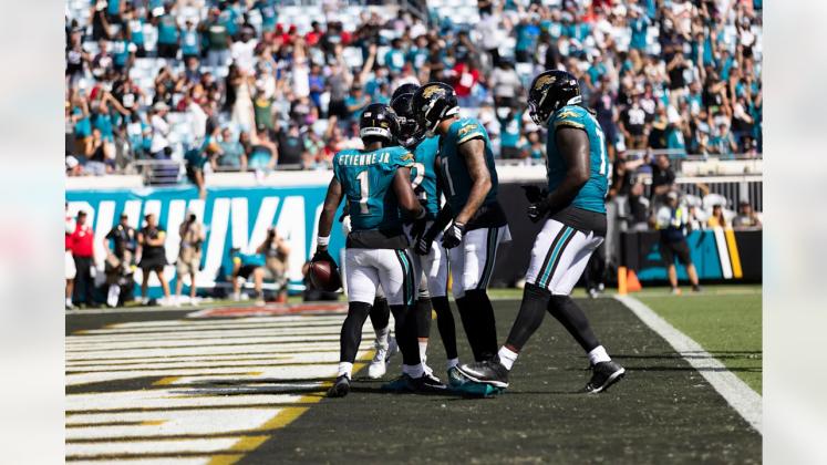 Photo courtesy of Jacksonville Jaguars Travis Etienne Jr. celebrates on Sunday with teammates in the end zone.
