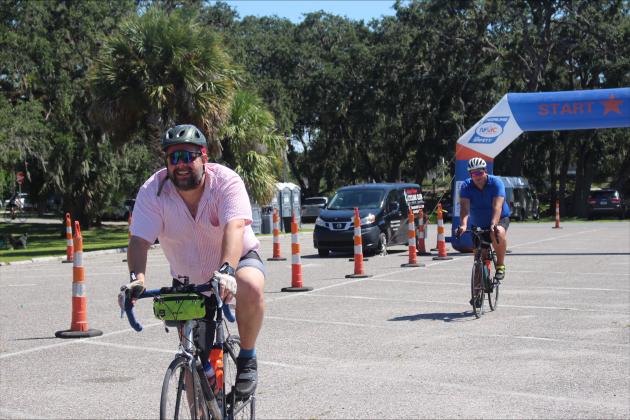 Riders crossing the Watermelon Ride finish line at the Atlantic Rec Center.