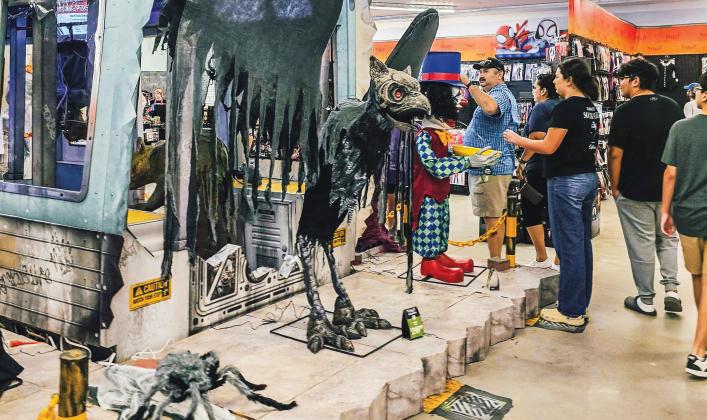 Customers on Aug. 20 interact with merchandise at Spirit Halloween. Photos by Ashley Chandler/News-Leader
