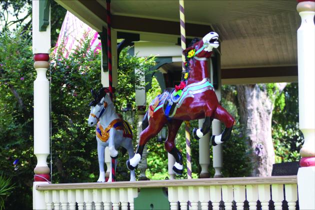 Painted horses on the porch of the home on Aug 27 by Marisa DeMar/News-Leader