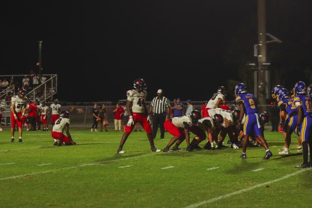 Players line up for an extra point attempt that was no-good. The missed PAT ended up being the game-deciding moment. The Pirates defeated the Indians 28-27. Photo by Ashley Chandler/News-Leader