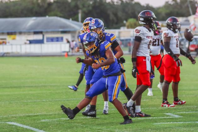 Traivon Martin celebrates his touchdown in the first quarter of a Pirate win over the Fort White Indians on Friday.