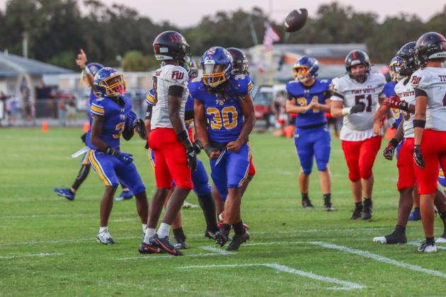 Traivon Martin celebrates his touchdown in the first quarter of a Pirate win over the Fort White Indians on Friday.