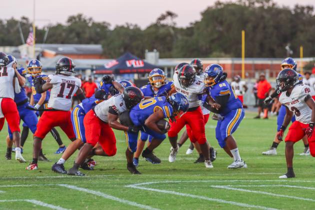 Traivon Martin carries the ball into the end-zone for a touchdown in the first quarter of a Pirate win over the Fort White Indians on Friday.