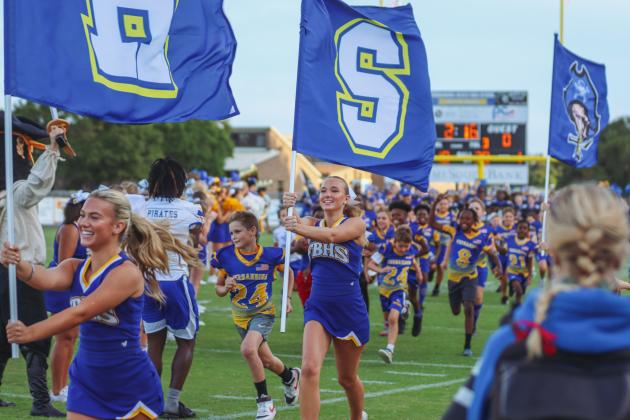 Fernandina Beach cheerleaders and future Pirate athletes led the Pirates onto the field Friday for their game against the Indians. Photo by Ashley Chandler/News-Leader