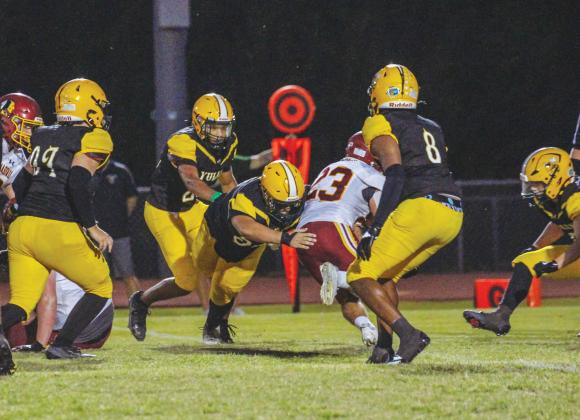 Hornets make a tackle in Week Five. Photo by Marisa DeMar/News-Leader