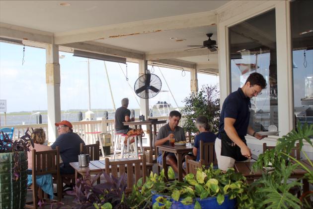 Customers enjoying one last meal and view from Brett’s on Friday. 