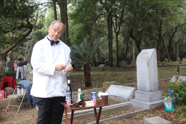 Bob Duffy stands over his vintage barber gear to portray John Conrad Rutishauser in the Graveside Chronicles. 