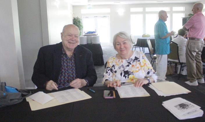 Betsy Schoelen, president of The Baptist Medical Center of Nassau’s Auxiliary group and the treasurer, Chuck Comeau greet volunteers at the Fernandina Beach Golf Club during their celebratory Luncheon on Thursday.  Marisa DeMar/News-Leader 