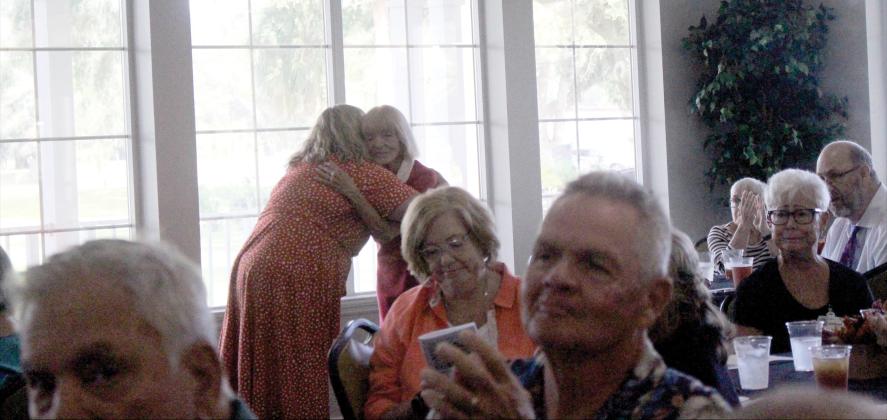 Tara Beth Anderson, president of The Baptist Medical Center of Nassau, gives special recognition to volunteers who served for over a decade.  Marisa DeMar/News-Leader 