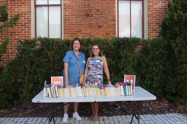 Claudia Zane and Mary Kay Lundy in front of the book swap table at the FOL book swap on Sept. 30 Photos by Marisa DeMar/News-Leader