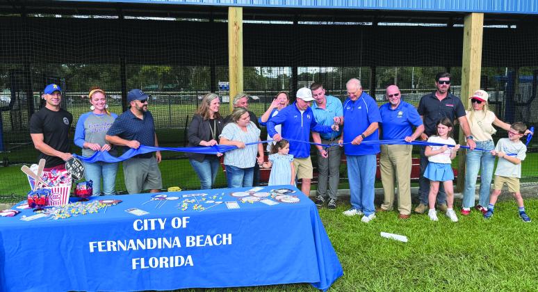 Officials cut the ribbon last week on batting cages at Central Park.
