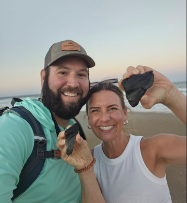  Matt and Alice Henry hold their megalodon pieces found near the North Beach Access Point in Fernandina Beach on Sept. 16.  Submitted by Matt Henry 