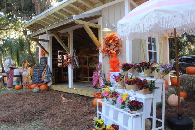 The mini farmers market at the grand opening stocked with fresh produce, flowers and baked goods.