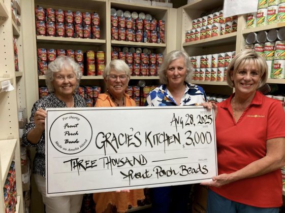 From left: Lucy Bryan, Debbie Pakradooni, Front Porch Beads President Frances Peters and MaryEllen Crocker during a $3,000 check presentation to Gracie’s Kitchen. Submitted by Dan Groth