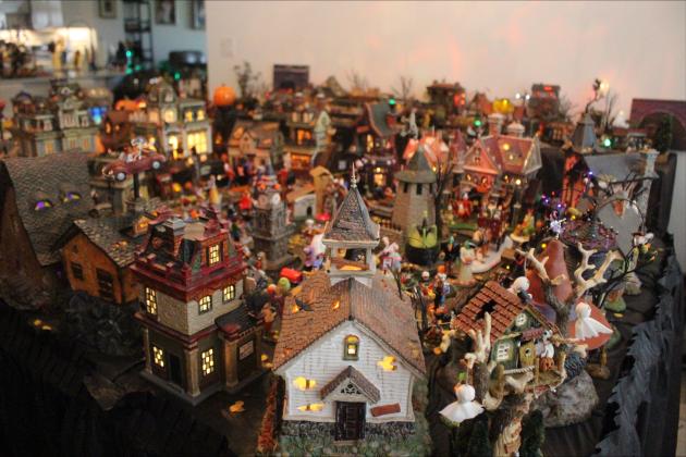 Barb Looney’s Halloween village aligned across her dining room and living room space. By Marisa DeMar/News-Leader