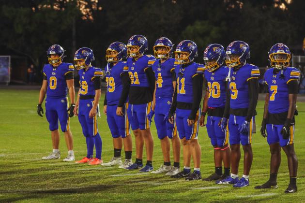 Friday was Senior Night for the Pirates. The Seniors walked arm and arm to midfield to join Senior captains for the coin toss on Oct. 24. Photo by Ashley Chandler/News-Leader