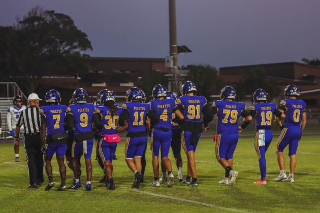 Friday was Senior Night for the Pirates. The Seniors walked arm and arm to midfield to join Senior captains for the coin toss on Oct. 24. Photo by Ashley Chandler/News-Leader