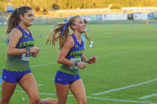 Mikaela Nichols and Grace Scuderi head to the finish line during Wednesday's race. Nichols in front with a 21-minute and 46.6-second time to Scuderi’s 21 minutes and 46.9 seconds. Photo by Ashley Chandler/News-Leader