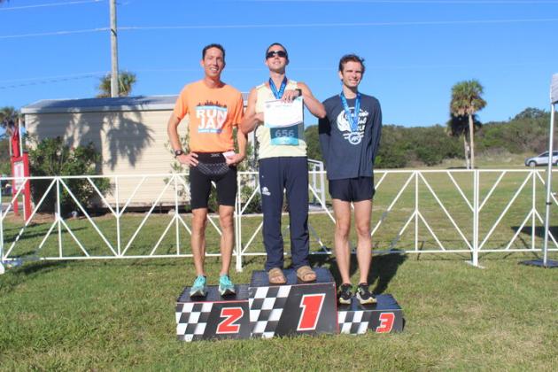 The men's half marathon winners, Jason Macaluso, Matthew Nelson in second, and Bryan Robison in third. 