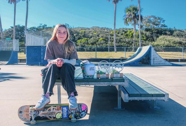 Coco Waldo, 11, with her trophies from the Exposure Skate competition at Poe Pinson Skate Park Fernandina Beach on Tuesday. Photo by Marisa DeMar/News-Leader