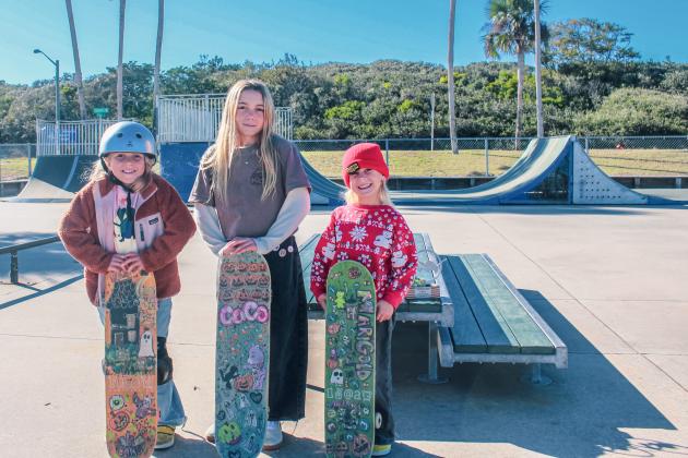 Prim, Coco and Goldie Waldo pose with their boards Nov. 11 at the Poe Pinson Skate Park in Fernandina Beach. Photo by Marisa DeMar/News-Leader