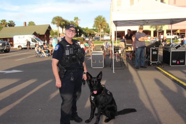The Fernandina Beach Police Community Engagement Officer, Tina Smith, and Community Engagement Ambassador dog Hanna at National Night Out. By Marisa DeMar/News-Leader