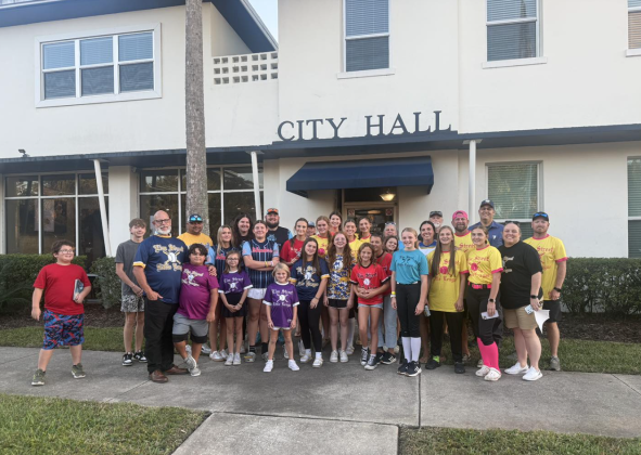 Photo from Elm Street Little League Facebook  Elm Street Little League president, coaches, and players outside of City Hall to advocate for the three new fields at the Parks and Recreation meeting Oct. 14.