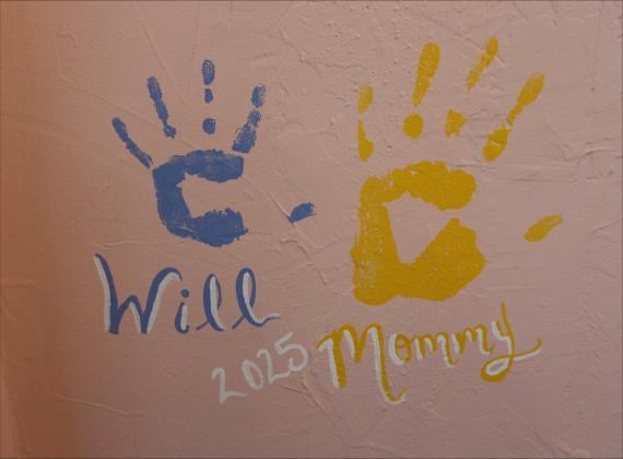 Mattiello’s son Will’s handprint on the wall at A Will and A Whisk. By Marisa DeMar/News-Leader