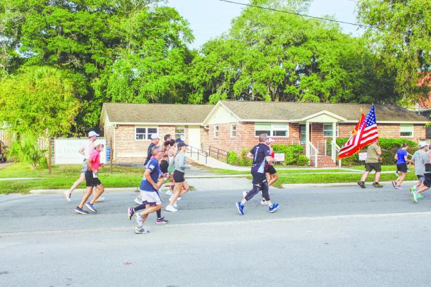 Participants run Saturday in the annual Veterans Day 5K.