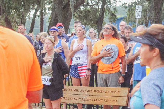 The National Anthem plys ahead of the race hosted by Cross the Line Foundation.