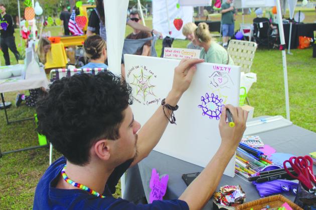 A community art activity at a Community Care Day booth.