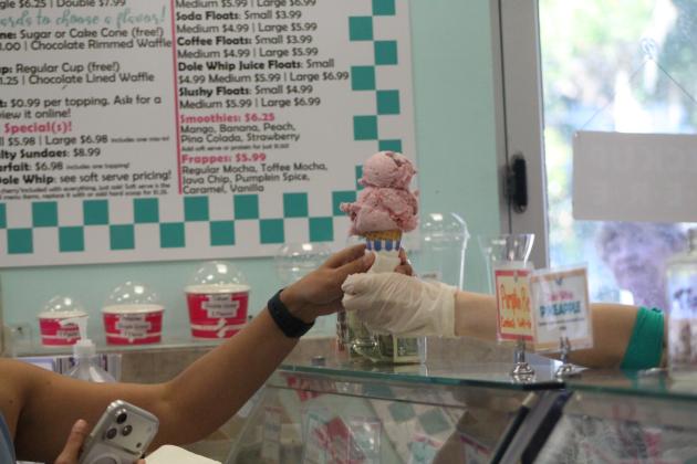 DeNucci’s manager Brooke Drechsler serves customers an ice cream cone on Nov 20. By Marisa DeMar/News-Leader
