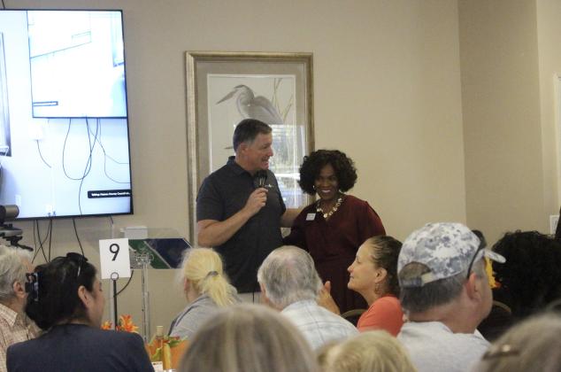 Janice Ancrum stands with News4Jax Anchor, Kent Justice to commemorate the occasion. By Marisa DeMar/News-Leader