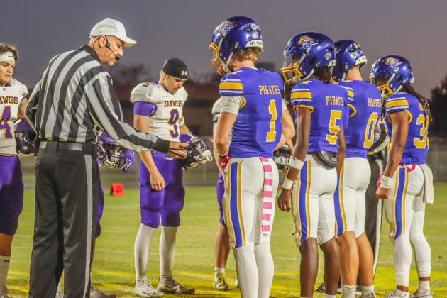 Pirate football captains a the coin toss on Oct. 31. Photo by Ashley Chandler/News-Leader