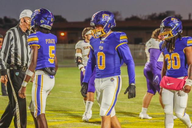 Pirate football captains a the coin toss on Oct. 31. Photo by Ashley Chandler/News-Leader